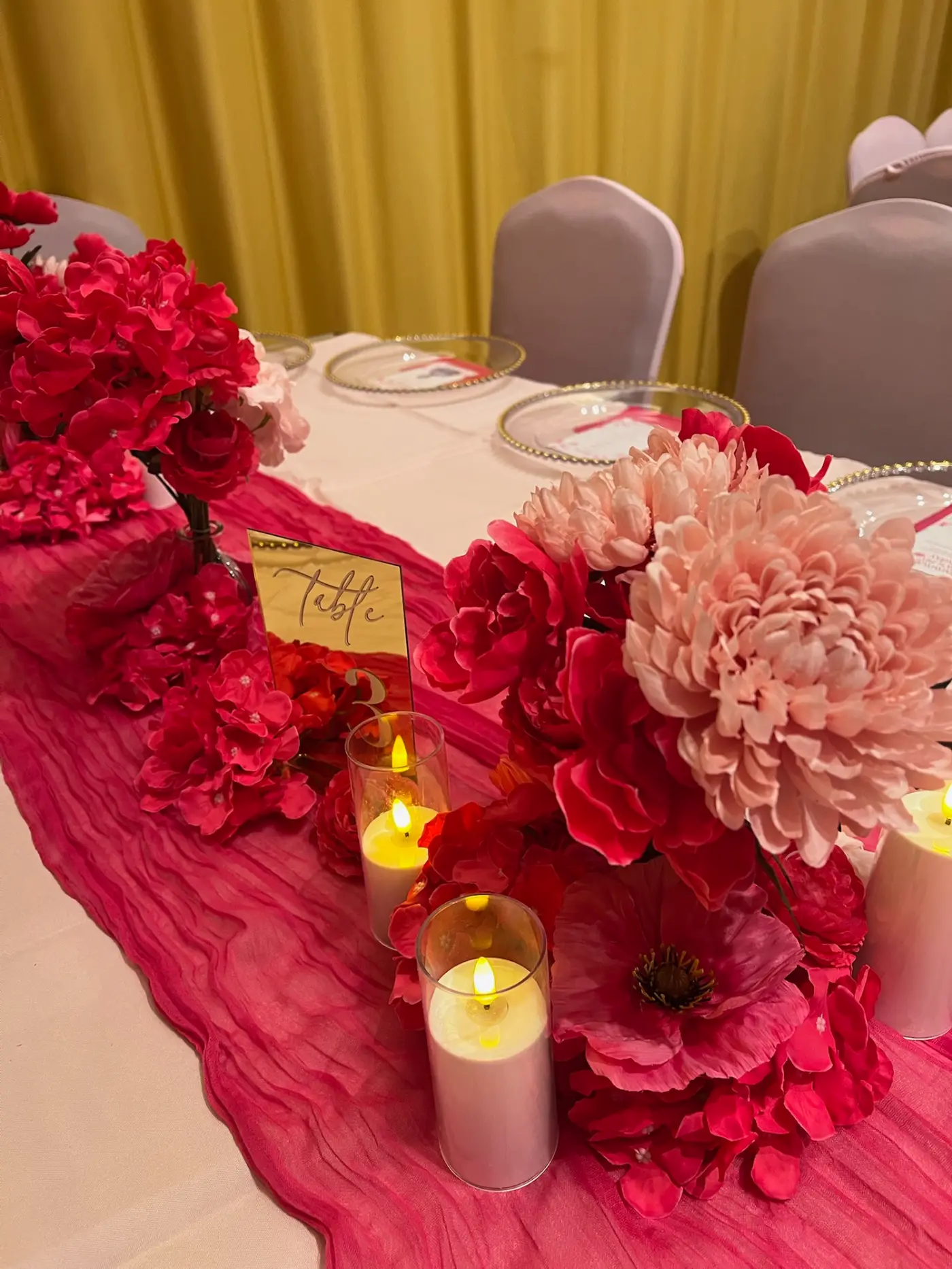 Personalised arch backdrop with flower arrangement