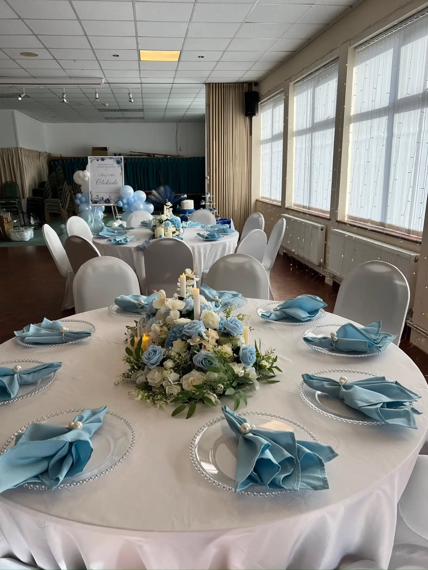 Dusty blue and ivory wedding reception room